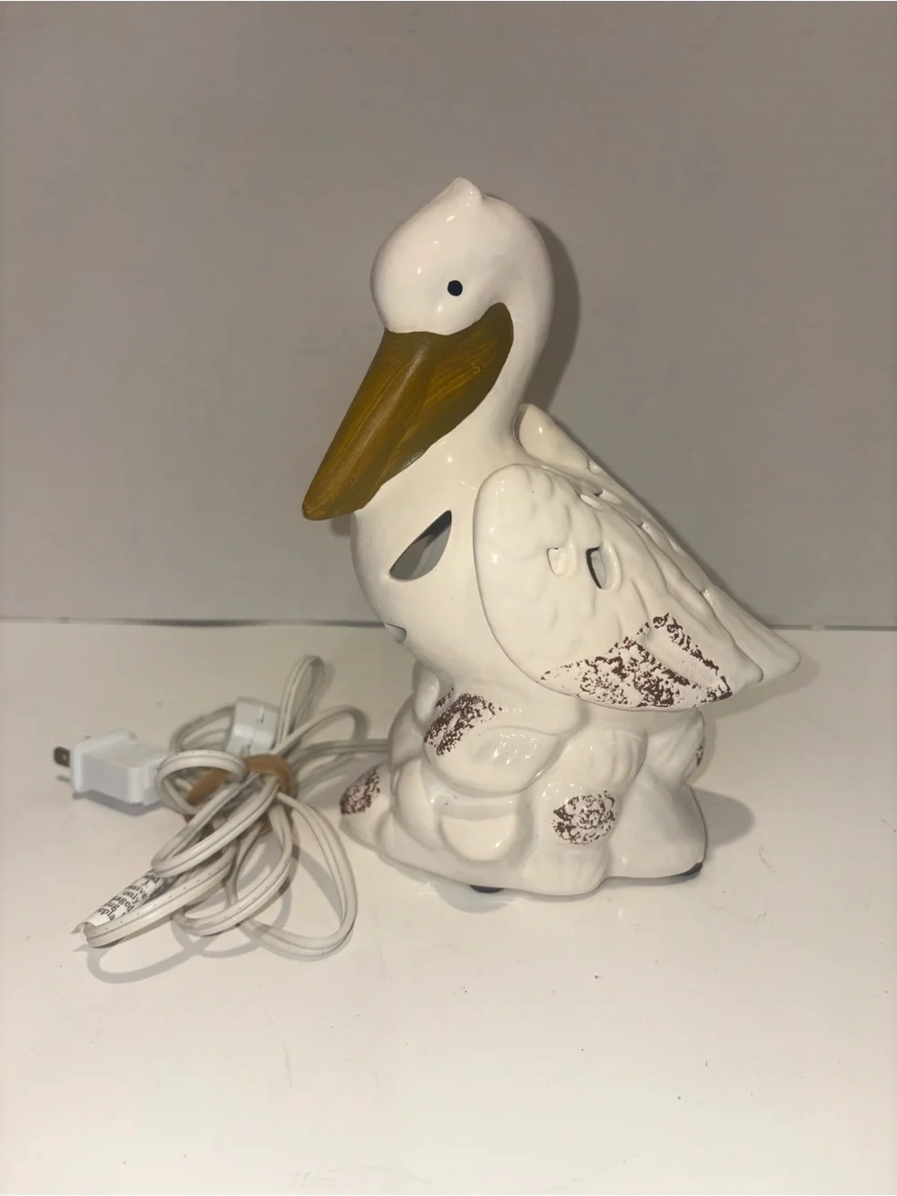 Kirklands White Ceramic Pelican Accent Night Light with Gold Beak